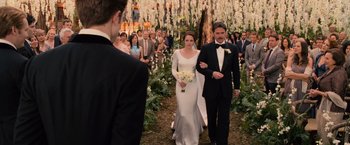 Movie still from “The Twilight Saga: Breaking Dawn - Part 1” (2011), directed by Bill Condon – A bride and groom walk down the aisle of their wedding; Wide shot, Over the shoulder angle