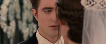Movie still from “The Twilight Saga: Breaking Dawn - Part 1” (2011), directed by Bill Condon – A man's face as a woman looks on; Close Up shot, Over the shoulder angle