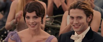 Movie still from “The Twilight Saga: Breaking Dawn - Part 1” (2011), directed by Bill Condon – A man and a woman smile for a picture; Close Up shot, Over the shoulder angle