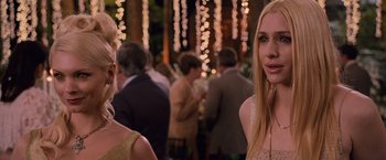 Movie still from “The Twilight Saga: Breaking Dawn - Part 1” (2011), directed by Bill Condon – Two women standing next to each other at a party; Close Up shot, Over the shoulder angle
