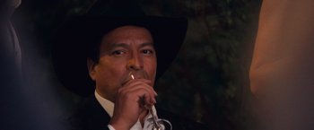 Movie still from “The Twilight Saga: Breaking Dawn - Part 1” (2011), directed by Bill Condon – A man in a cowboy hat is smoking a cigarette; Close Up shot, Low angle