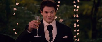 Movie still from “The Twilight Saga: Breaking Dawn - Part 1” (2011), directed by Bill Condon – A man holding a glass of champagne in his right hand; Medium shot, Low angle