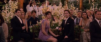 Movie still from “The Twilight Saga: Breaking Dawn - Part 1” (2011), directed by Bill Condon – A couple of people that are sitting on a chair; Medium shot, Over the shoulder angle