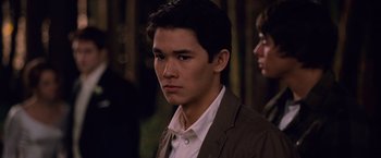 Movie still from “The Twilight Saga: Breaking Dawn - Part 1” (2011), directed by Bill Condon – A man in a brown jacket and a white shirt; Close Up shot, Over the shoulder angle