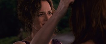 Movie still from “The Twilight Saga: Breaking Dawn - Part 1” (2011), directed by Bill Condon – A woman's face with her hand up to her face; Close Up shot, Over the shoulder angle