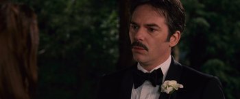 Movie still from “The Twilight Saga: Breaking Dawn - Part 1” (2011), directed by Bill Condon – A man in a tuxedo with a flower in his lapel; Close Up shot, Over the shoulder angle