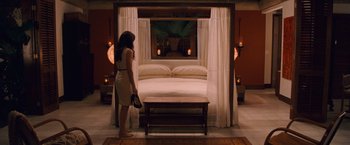 Movie still from “The Twilight Saga: Breaking Dawn - Part 1” (2011), directed by Bill Condon – A woman standing in front of a canopy bed in a bedroom; Wide shot, High angle