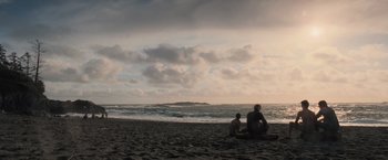 Movie still from “The Twilight Saga: Breaking Dawn - Part 1” (2011), directed by Bill Condon – Two people sitting on the beach watching the sunset; Extreme Wide shot, Over the shoulder angle