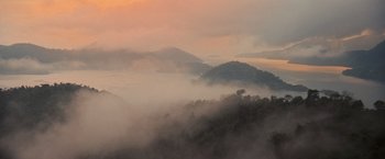 Movie still from “The Twilight Saga: Breaking Dawn - Part 1” (2011), directed by Bill Condon – A view of a mountain range in the fog; Extreme Wide shot, High angle