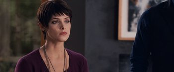 Movie still from “The Twilight Saga: Breaking Dawn - Part 1” (2011), directed by Bill Condon – A woman with short black hair wearing a purple shirt; Close Up shot, Over the shoulder angle
