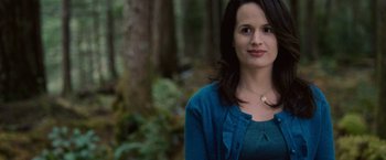Movie still from “The Twilight Saga: Breaking Dawn - Part 1” (2011), directed by Bill Condon – A woman standing in front of some trees; Close Up shot, Over the shoulder angle