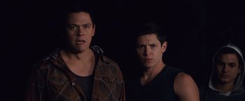 Movie still from “The Twilight Saga: Breaking Dawn - Part 1” (2011), directed by Bill Condon – Two young men standing next to each other in the dark; Medium shot, Low angle