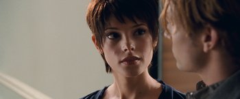 Movie still from “The Twilight Saga: Breaking Dawn - Part 1” (2011), directed by Bill Condon – A person with short brown hair; Close Up shot, Over the shoulder angle