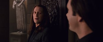 Movie still from “The Twilight Saga: Breaking Dawn - Part 1” (2011), directed by Bill Condon – A man with long black hair is looking into a mirror; Close Up shot, Over the shoulder angle