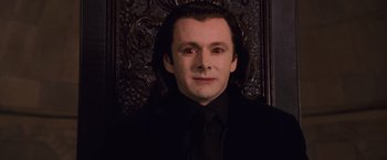 Movie still from “The Twilight Saga: Breaking Dawn - Part 1” (2011), directed by Bill Condon – A person wearing a suit and tie; Close Up shot, High angle