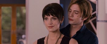 Movie still from “The Twilight Saga: Breaking Dawn - Part 2” (2012), directed by Bill Condon – A woman with short hair and a man with short hair; Close Up shot, Over the shoulder angle