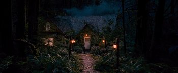 Movie still from “The Twilight Saga: Breaking Dawn - Part 2” (2012), directed by Bill Condon – A path leading to a house at night with lights on; Extreme Wide shot, High angle