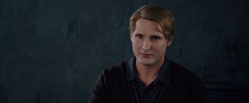 Movie still from “The Twilight Saga: Breaking Dawn - Part 2” (2012), directed by Bill Condon – A man in a black shirt is looking at the camera; Close Up shot, Over the shoulder angle