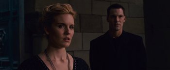 Movie still from “The Twilight Saga: Breaking Dawn - Part 2” (2012), directed by Bill Condon – A man and a woman standing next to each other in front of a brick wall; Close Up shot, Over the shoulder angle