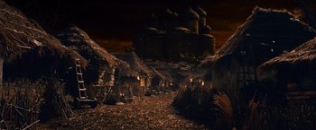 Movie still from “The Twilight Saga: Breaking Dawn - Part 2” (2012), directed by Bill Condon – An image of an ancient village in the middle of the night; Extreme Wide shot, High angle