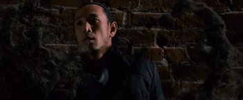 Movie still from “The Twilight Saga: Breaking Dawn - Part 2” (2012), directed by Bill Condon – A man in a black jacket is smoking; Close Up shot, Low angle