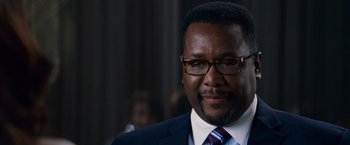 Movie still from “The Twilight Saga: Breaking Dawn - Part 2” (2012), directed by Bill Condon – A person wearing a suit and tie; Close Up shot, Over the shoulder angle