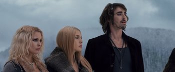 Movie still from “The Twilight Saga: Breaking Dawn - Part 2” (2012), directed by Bill Condon – A man and a woman standing next to each other; Close Up shot, Low angle