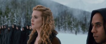 Movie still from “The Twilight Saga: Breaking Dawn - Part 2” (2012), directed by Bill Condon – A woman with long blonde hair standing in the snow; Close Up shot, Over the shoulder angle