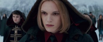 Movie still from “The Twilight Saga: Breaking Dawn - Part 2” (2012), directed by Bill Condon – A person wearing a coat and tie; Close Up shot, Over the shoulder angle