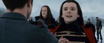 Movie still from “The Twilight Saga: Breaking Dawn - Part 2” (2012), directed by Bill Condon – Two men are talking to each other outside; Close Up shot, Over the shoulder angle