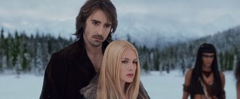 Movie still from “The Twilight Saga: Breaking Dawn - Part 2” (2012), directed by Bill Condon – A man and a woman standing next to each other in the snow; Close Up shot, Low angle