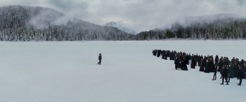 Movie still from “The Twilight Saga: Breaking Dawn - Part 2” (2012), directed by Bill Condon – A group of people standing on top of a snow covered slope; Extreme Wide shot, High angle