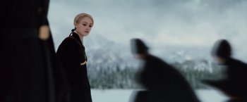 Movie still from “The Twilight Saga: Breaking Dawn - Part 2” (2012), directed by Bill Condon – A woman standing in front of a man in a black suit; Close Up shot, Over the shoulder angle