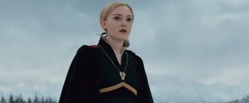 Movie still from “The Twilight Saga: Breaking Dawn - Part 2” (2012), directed by Bill Condon – A woman in a black dress with a bird on her shoulder; Close Up shot, Low angle