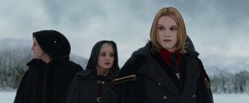 Movie still from “The Twilight Saga: Breaking Dawn - Part 2” (2012), directed by Bill Condon – Two women in capes and hoods standing next to each other; Close Up shot, Low angle