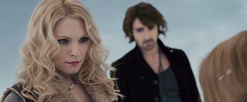 Movie still from “The Twilight Saga: Breaking Dawn - Part 2” (2012), directed by Bill Condon – A woman and a man standing next to each other; Close Up shot, Over the shoulder angle