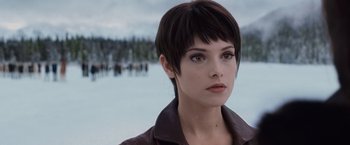 Movie still from “The Twilight Saga: Breaking Dawn - Part 2” (2012), directed by Bill Condon – A person with short black hair; Close Up shot, Over the shoulder angle