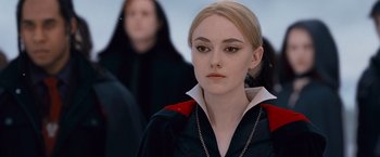 Movie still from “The Twilight Saga: Breaking Dawn - Part 2” (2012), directed by Bill Condon – A young woman in a red and black jacket; Close Up shot, Over the shoulder angle