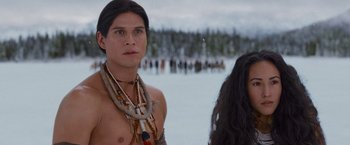 Movie still from “The Twilight Saga: Breaking Dawn - Part 2” (2012), directed by Bill Condon – A man and a woman standing next to each other in front of a body of water; Close Up shot, Over the shoulder angle