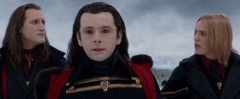 Movie still from “The Twilight Saga: Breaking Dawn - Part 2” (2012), directed by Bill Condon – A person with long hair wearing a uniform; Close Up shot, Over the shoulder angle
