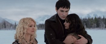 Movie still from “The Twilight Saga: Breaking Dawn - Part 2” (2012), directed by Bill Condon – A man and a woman hugging each other in the snow; Close Up shot, Over the shoulder angle