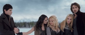 Movie still from “The Twilight Saga: Breaking Dawn - Part 2” (2012), directed by Bill Condon – Two women standing next to each other in the snow; Medium shot, Low angle