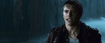 Movie still from “The Twilight Saga: Eclipse” (2010), directed by David Slade – A man with wet hair and a wet jacket on; Close Up shot, Over the shoulder angle