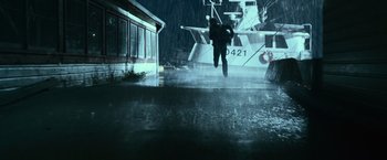 Movie still from “The Twilight Saga: Eclipse” (2010), directed by David Slade – A man is jumping in the air in the rain; Wide shot, High angle
