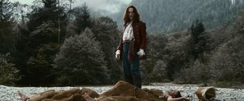 Movie still from “The Twilight Saga: Eclipse” (2010), directed by David Slade – A man standing in the middle of a field; Wide shot, High angle
