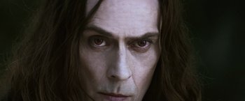 Movie still from “The Twilight Saga: Eclipse” (2010), directed by David Slade – A man's face with long black hair; Close Up shot, Low angle