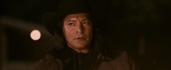 Movie still from “The Twilight Saga: Eclipse” (2010), directed by David Slade – A person with long hair wearing a hat; Close Up shot, Low angle