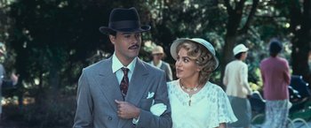 Movie still from “The Twilight Saga: Eclipse” (2010), directed by David Slade – A man and a woman dressed in suits and hats; Medium shot, Low angle