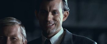 Movie still from “The Twilight Saga: Eclipse” (2010), directed by David Slade – A person wearing a suit and tie; Close Up shot, Low angle