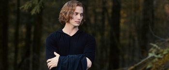 Movie still from “The Twilight Saga: Eclipse” (2010), directed by David Slade – A man with long brown hair wearing a black shirt; Medium shot, Over the shoulder angle